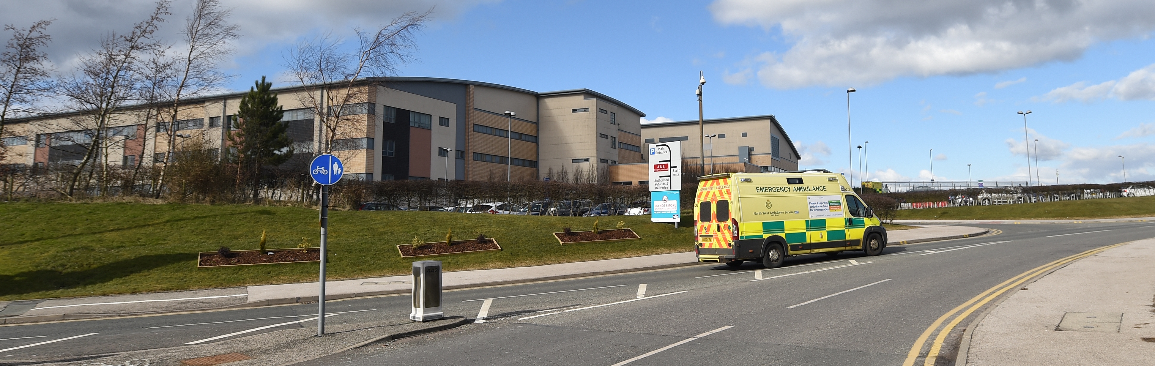 Ambulance driving past Royal Blackburn Teaching Hospital